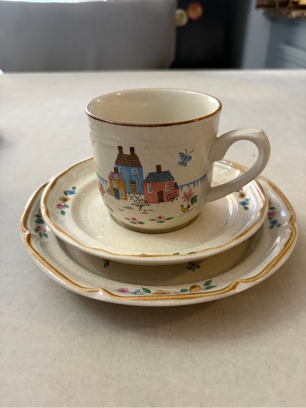 International Cream Ceramic Cup and Saucer Set with Hand-Painted Village Design